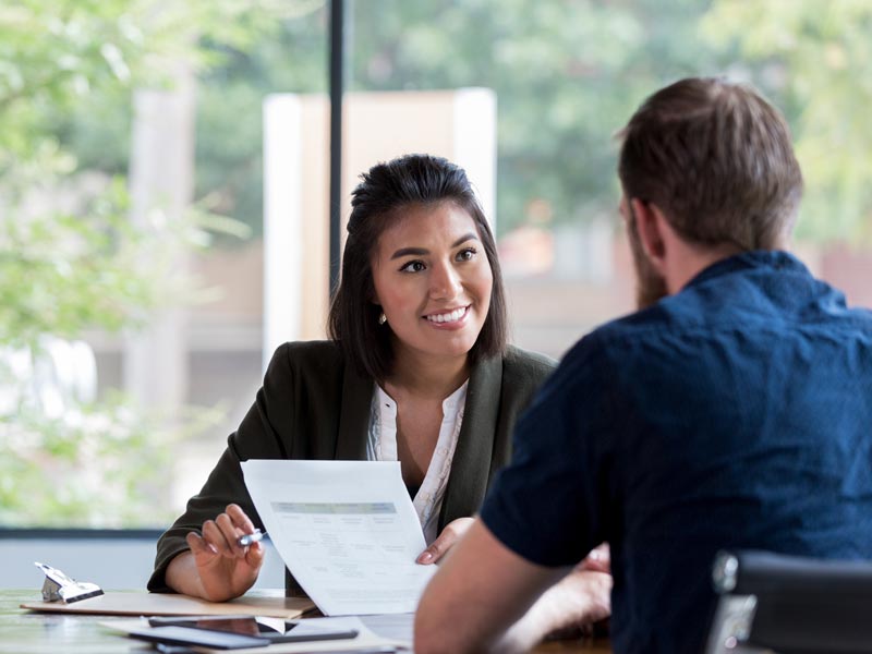 manager and customer signing contracts