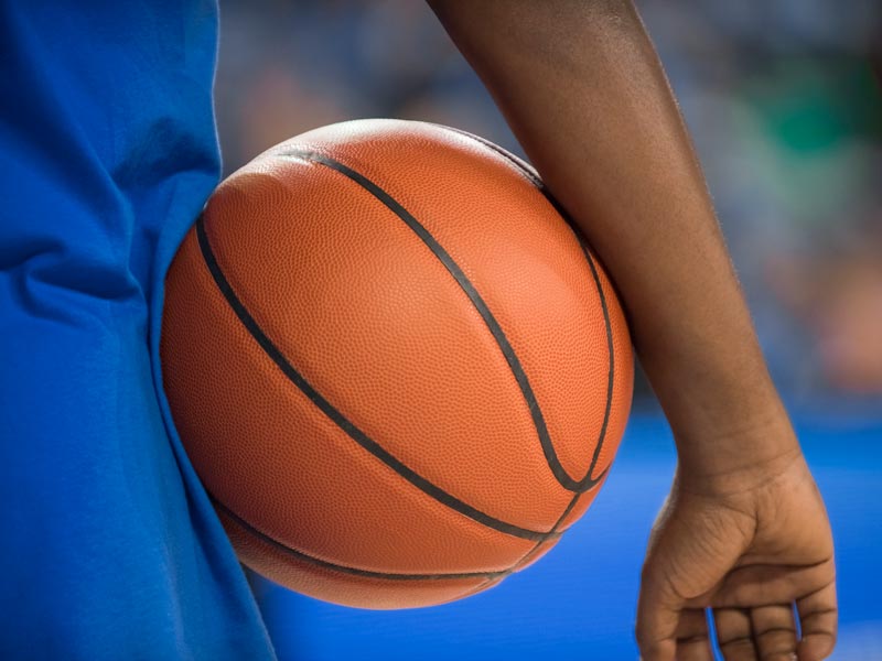 person holding basketball